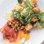 Eggs with Serrano Ham and Manchego Cheese, Green Olive Relish, and Migas